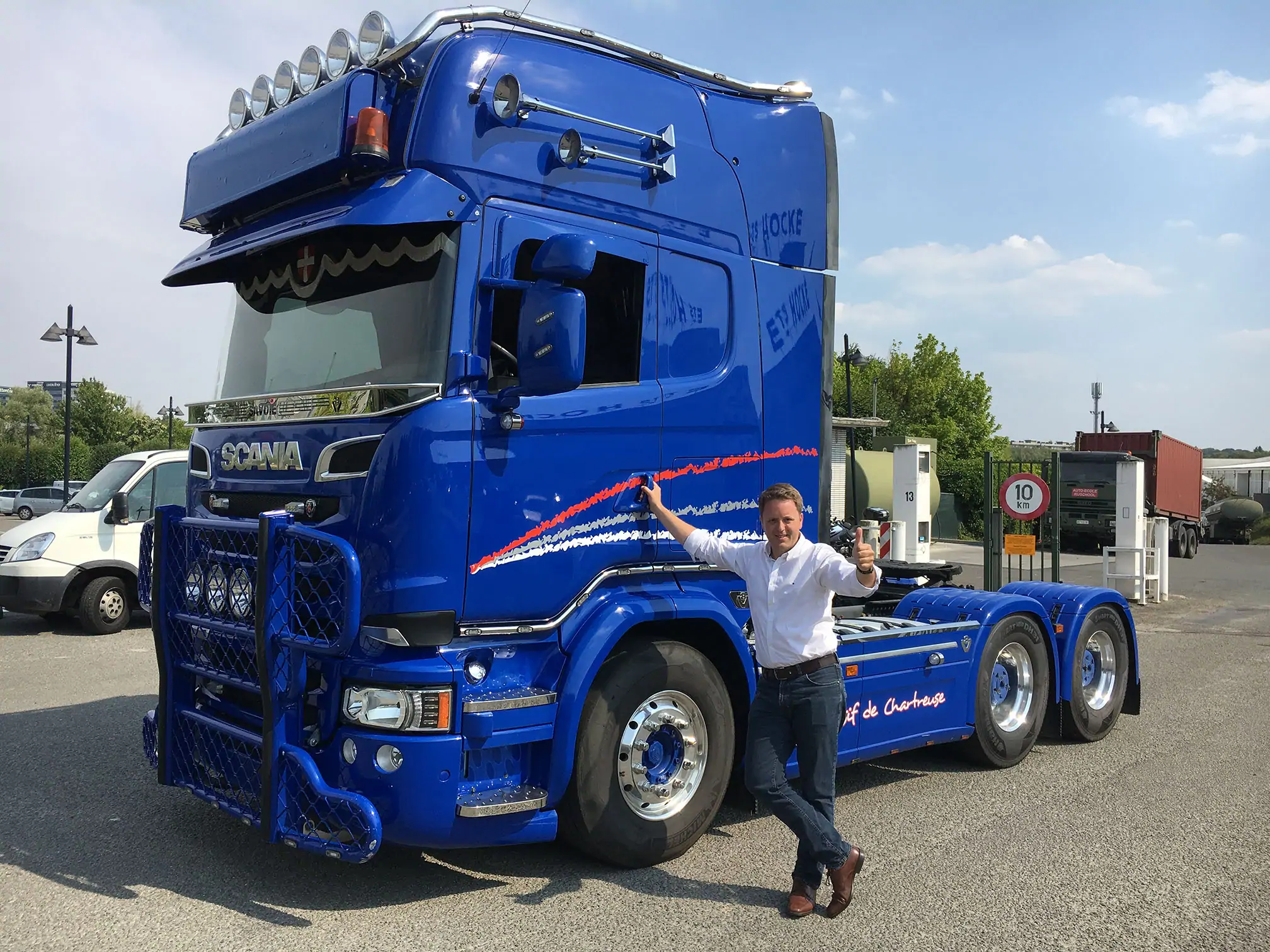 Red DAF Truck driving on a road